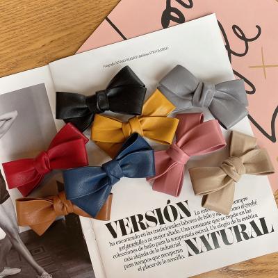 China 2021 New PU Fashion 10cm Handmade Hairpins Premium Cross Leather Bow Hair Clips Accessories For Girls for sale