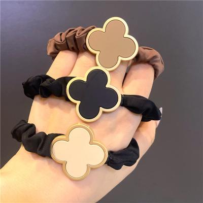 China Fashion Women's Metal Four Clover Leaf Large Intestine High Quality Hair Ring Fashion Hair Accessories Retro Elastic Headbands For Women for sale