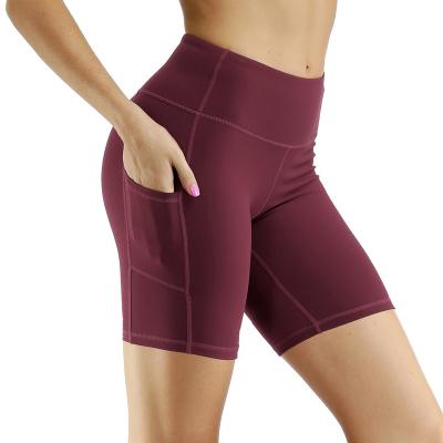 China Breathable Nylon Biker Shorts Women Gym Shorts With Pocket High Waisted Compression Athletic Tights For Woman for sale