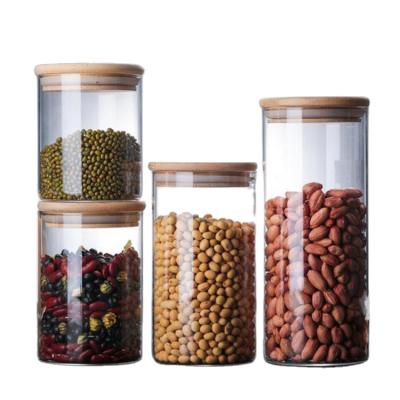 China Sustainable Hot Sale Storage Grain Candy Sealed Refrigerator High Storage Jar Glass Borosilicate Glass Jar With Bamboo Wood Lid for sale