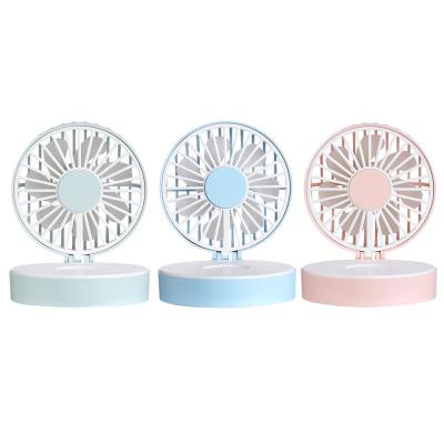 China 2022 Low Noise Creative Multifunctional Mini Cake With Makeup Mirror ABS Low Noise Desktop Mute USB Rechargeable Handheld Practical Portable Fan for sale