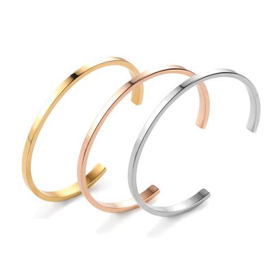 China Hot Selling Inspired Custom Silver and Rose Gold Stainless Steel Alphabet Engraved Letter Cuff Bracelet for sale