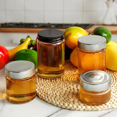 China FOOD GRADE Stock Glass Jar Ergo Honey Jar Glass Jam Jars With Black Deep Twist Off Lids for sale