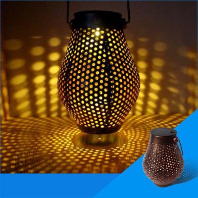 China Hot Selling Solar Wrought Iron Garden Lantern Outdoor Branch Yard Hollow Projection Lamp Garden Landscape Pendant Lighting for sale