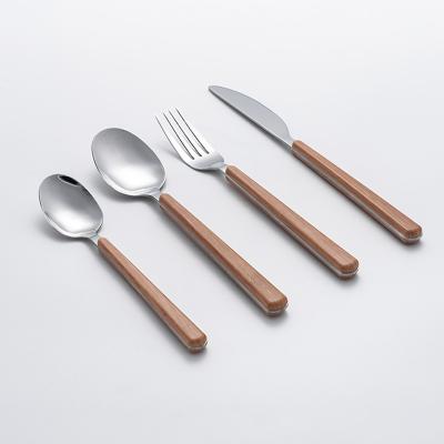 China Sustainable European Simplish 16PCS Stainless Steel Silverware With Plastic Western Restaurant Cutlery Wooden Handle ABS Color Flatware Set for sale