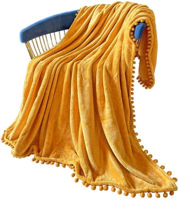 China Anti-Static Tassel Throw Blanket With Pompom Fringe Flannel Decor Soft Cozy Blanket For Couch Sofa Bed Camping Travel Blanket for sale