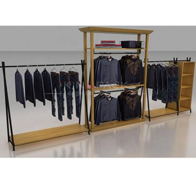 China Modern and fashion MDF wood with custom mental hanging clothes display rack furniture for retail apparel display racks for sale