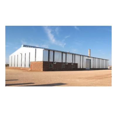 China Low Cost Steel Fabricated Metal Shed Kits House Design Prefab Steel Structure Workshop Te koop