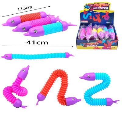 China Newest TPR 2022 Stretch Pipe Stir Toy Dog Dolphin Unicorn Lobster Shark Ingot Sensory Noise The Top Tube Pipe Toy for sale