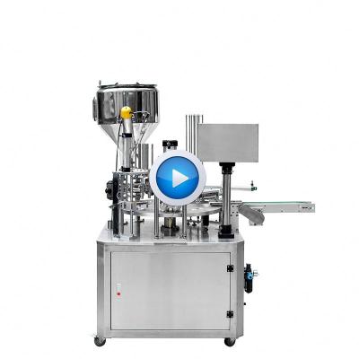 China Best Food Selling Automatic Rotary Type Plastic Yogurt Mineral Water Heating Cup Filling Sealing Machine for sale