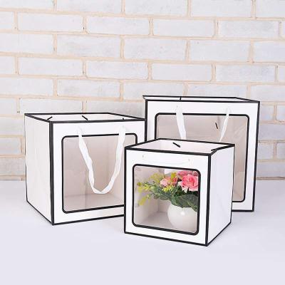 China Recyclable Portable Square Transparent Paper Window Bag Fashion PVC Rope Gift Flower Clear Paper Bag for sale