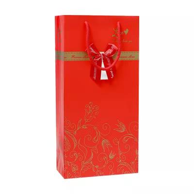 China Recyclable Luxury Customized Ribbon Bow Paper Bag Gold Printing Kraft Paper Wine Bottle Bag Gift Packaging for sale