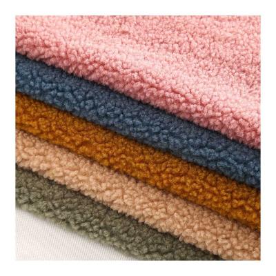 China Breathable Customizable 400gsm100% Polyester Brushed Solid Color Soft Breathable Sherpa Fleece Fabric For Winter Apparel for sale