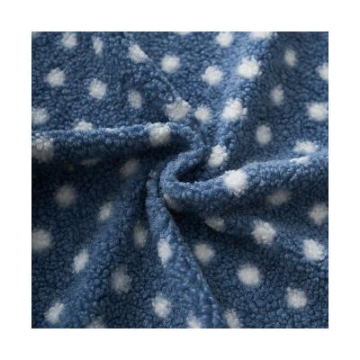 China 2022 fashion 500gsm 100% polyester warmgrained cashmere fleece breathable polka dot print fabric for winter wear for sale