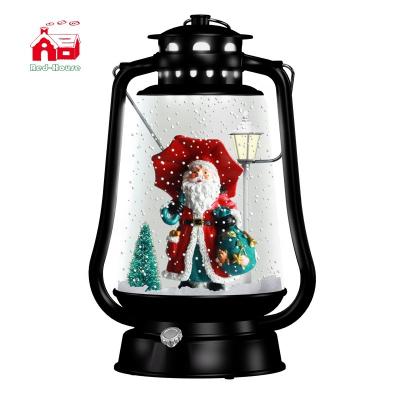 China Gifts Polyrein Santa Claus Christmas Ornaments Led Musical Lantern Christmas Barn Snowfall Lantern for sale