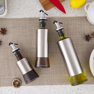 China Sustainable 200ml 300ml 500ml Customized Logo Food Grade Dispenser Glass Cooking Oil And Dressing Sauce Vinegar Bottles For Kitchen for sale