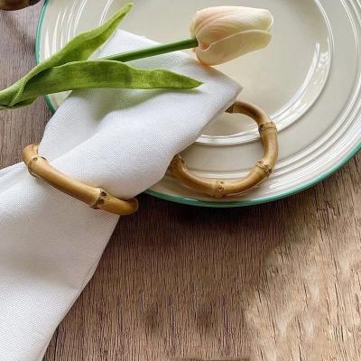 China Sustainable Handmade Wooden Napkin Rings Bamboo Table and Retro Rattan Round Napkin Rings for sale