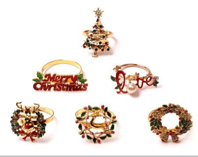 China New Viable Gold Christmas Napkin Rings Deer Napkin Ring Holder and Christmas Tree Garland for sale