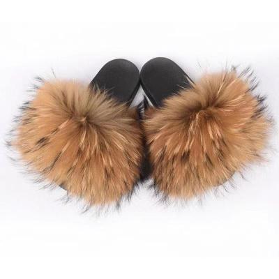 China Fashion trend fluffy brown raccoon fur real slippers hairy fox fur slides for women with logo for sale