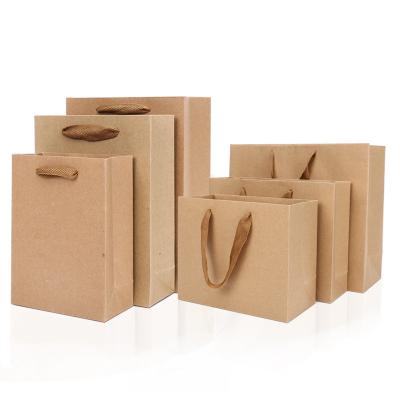 China Recycled Materials Sell High Quality Custom Brown Thick Paper Bag Packaging Shopping / Wholesale Gift / Clothes Paper Bag With Handle for sale