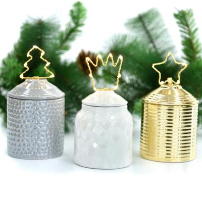 China Fashionable Luxury Multi Shape Pedestal Christmas Decorations Ceramic Candy Jar With Copper 10LED String Light for sale