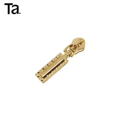 China TANAI Viable Custom Engraved Logo Zipper Sliders Handbag Metal Pullers Factory Price Zipper Puller for sale