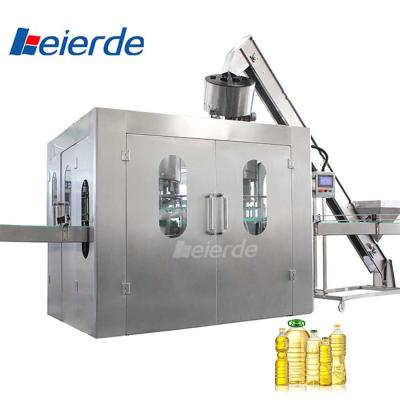 China 400BPH 500BPH Oil Filling Machine Oil Bottle Packing Machine 1500 KG for sale