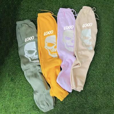 China Anti-wrinkle Winter Custom Loose Drawstring Pants Skull Embroidery Cotton Jogging Fleece Stacked Pants Sweatpants for sale