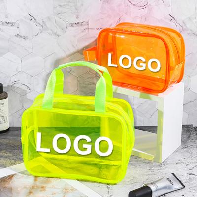 China Colorful Clear Cosmetics Organzier PVC Cosmetic Bags Vinyl Portable Transparent TPU Cosmetic Bag Clear PVC Wash Bag With Handle for sale