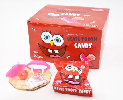 China Normal Halloween Devil Tooth Shaped Candy Jumping Lollipops Diamond Hard Candy With Toy for sale