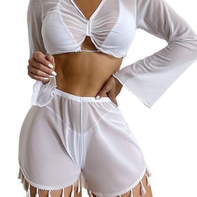 China Breathable Solid Color Tassel Beach Cover Up Outdoor Sun Protection Sexy Long Sleeve Bikini For Women for sale