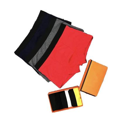 China BOXER BRIEFS IN Running Letter Print Mens Knitted Boxer Shorts Seamless Modal Underwear for sale