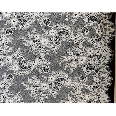 China New viable design African wedding eyelash lace fabric nylon white flower for ladies dress or wedding dress for sale