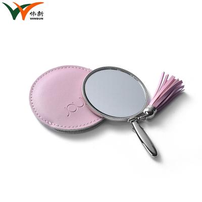 China Small Unbreakable Handheld Makeup Mirror With Decorative Tassel for sale