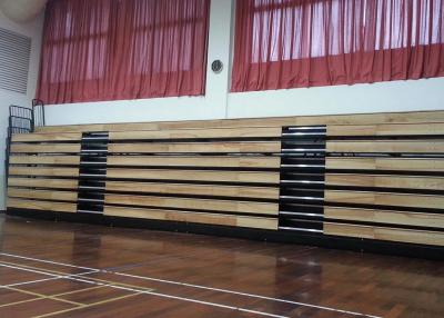 China Motorized Retractable Gym Seating Wooden Bench For Multi - Functional Hall for sale