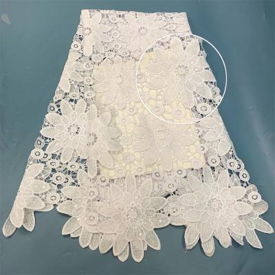 China Water Soluble 2021 Wholesale Pure White Cord Lace Sequins Embroidery Fabric French Luxury Wedding Dress Fabric Polyester Material Lace Designs for sale