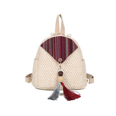 China PORTABLE Women Backpack Exquisite Retro Girls Cross - Body Shoulder Straw Bagpack Ladies Small Woven Bag With Tassel for sale