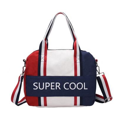 China 2021 Fashion Trend Sports Canvas Large Capacity Ladies Travel Duffel Bag For Women for sale