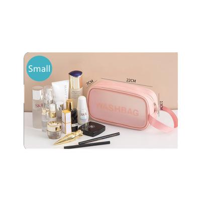 China Hot Selling Clear Cosmetic Bag Waterproof Logo Portable Bag Custom PU Makeup Bag Amazon Pink Transparent Travel Waterproof Bag for sale