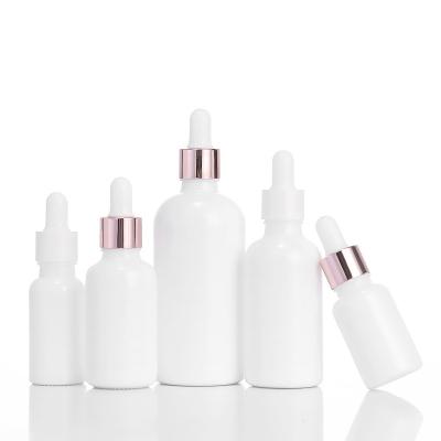 China 10ml 20ml 30ml 50ml 100ml Cosmetic Luxury Frosted White Glass Bottle Lotion Essential Oil Dropper Bottle With Lid for sale