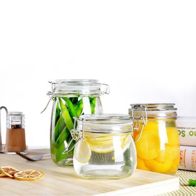 China Minimalist Wholesales Wide Mouth Mason Jar Glass Bottle With Flip Top Cap Storage Glass Jar With With Metal Clip for sale