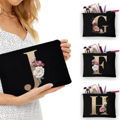 China Fashion Girl Black Polyester Makeup Bag Classic 26 Letter Pattern Gold Organizer Bag Pouch For Travel Women Cosmetic Bag for sale