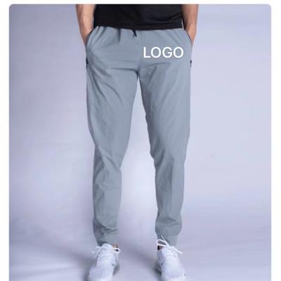 China Plus Size Customized Logo Printing Men Tracksuit Nylon Trotter Pants Sublimation Tracksuits Male Sport Wear Slim Fit Sweatpants for sale