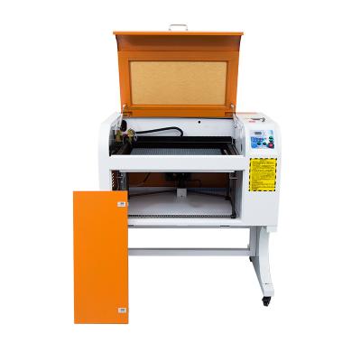 China Water Cooled Easy To Use 6040 Nonmetal Paper Cloth Engraving CO2 CNC Laser Cutter Machine for sale