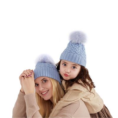 China JOINT Winter Women Knit Striped Beanie Hat With Pom Mommy And I Logo Mom Hat Custom Made for sale