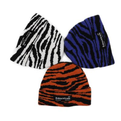 China JOINT Unisex Fashion Hip Hop Leopard Logo Skullcap Custom Beanie Hat for sale