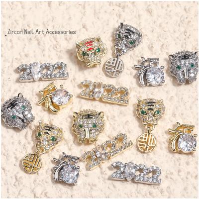 China Easy Apply 2022 New Year Zircon Nail Art Design Real Gold Electroplated Tiger Head Accessories for Nails for sale