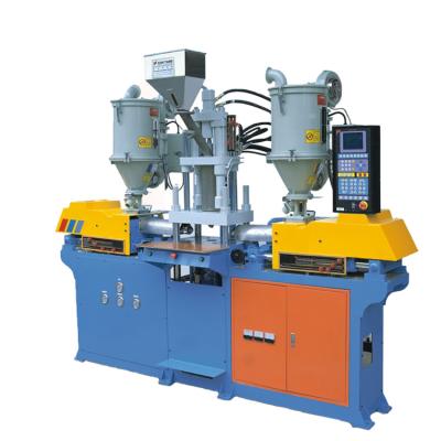 China Toothbrush Handle Vertical Three Color Injection Molding Making Machine for sale