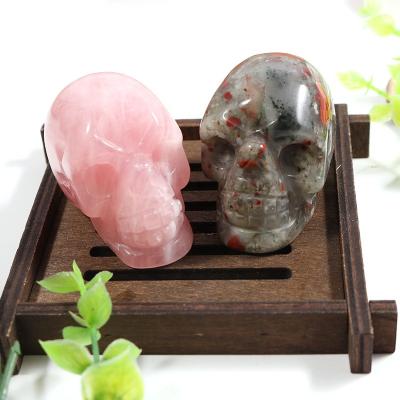 China Europe Large 2 Inch Skulls Statue Wholesale Custom Hand Carved Crystal Skulls Craft Rose Quartz Skulls Head for sale