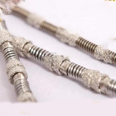 China Marble /Granite /Mine /Limestone /Sandstone /Basalt /Concrete Cutting Professional Spring Diamond Wire Saw Quick Cut Granite Marble Wire Rope With Long Life Diamond Beads for sale